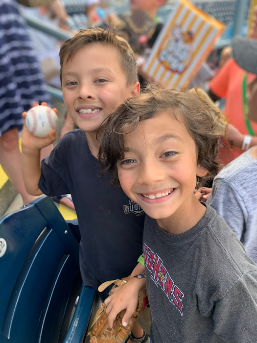 Boys-catch-a-ball-at-the-Mud-Hens-Game